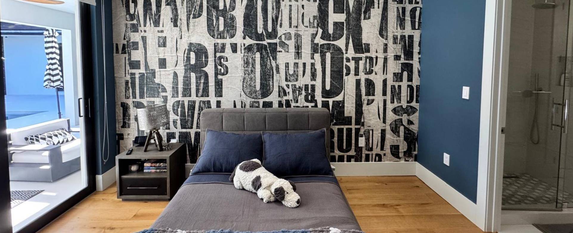 Graphic wallpaper feature wall in a bedroom